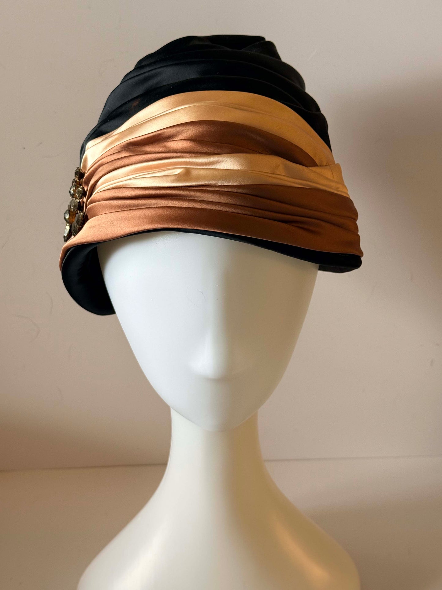 Vintage 1960s Ferncroft Satin Turban Hat – Black, Champagne & Bronze Draped Cloche Hat with Rhinestone Brooch