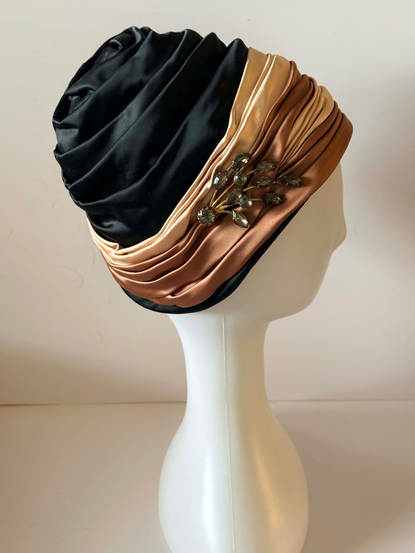 Vintage 1960s Ferncroft Satin Turban Hat – Black, Champagne & Bronze Draped Cloche Hat with Rhinestone Brooch