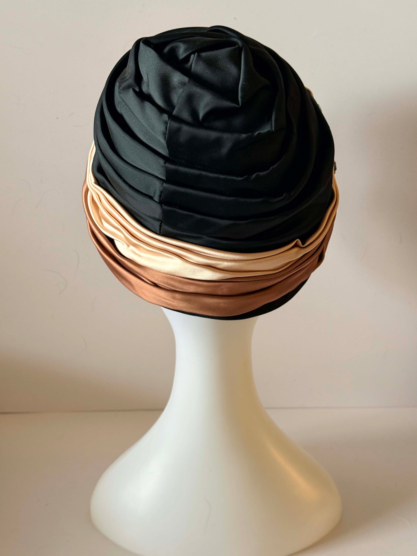 Vintage 1960s Ferncroft Satin Turban Hat – Black, Champagne & Bronze Draped Cloche Hat with Rhinestone Brooch